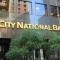 City National Bank Fined $65 Million